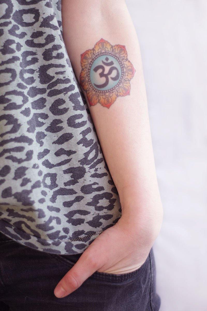 Om Tattoos Done By @ajtattoopune Om is a symbol of holy sound and  spirituality in Hinduism. In Hinduism, Om is one of the most importan... |  Instagram